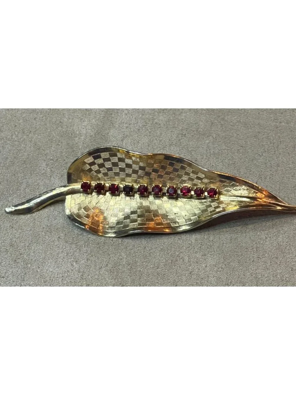 Vintage 60s Etched Gold Tone Red Rhinestone Curved Leaf Pin Brooch MCM